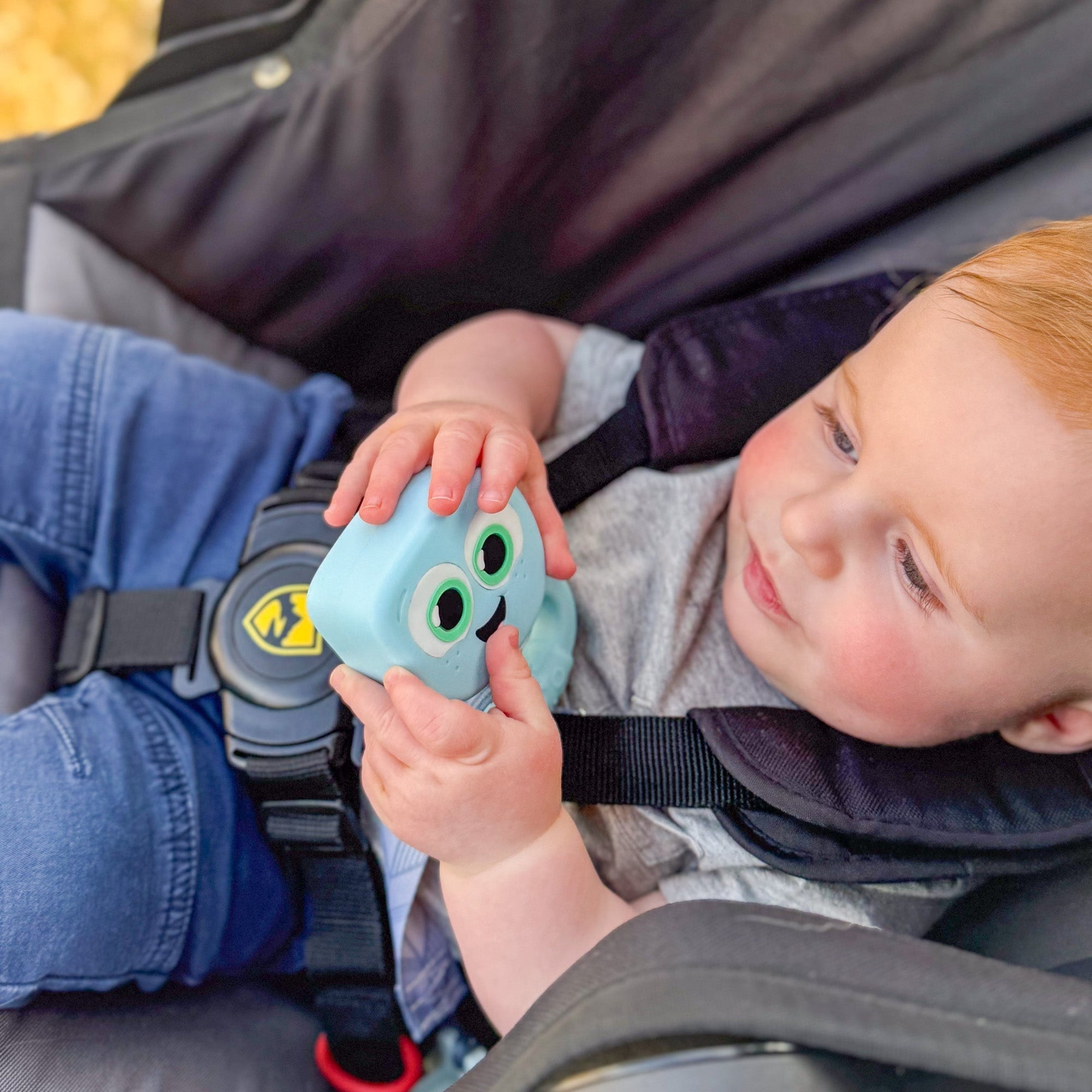 baby holding rattle