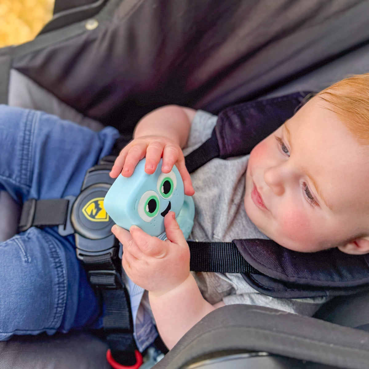 baby holding rattle